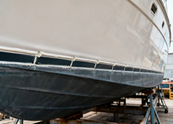 3M marine sealant applied to boat hull below waterline